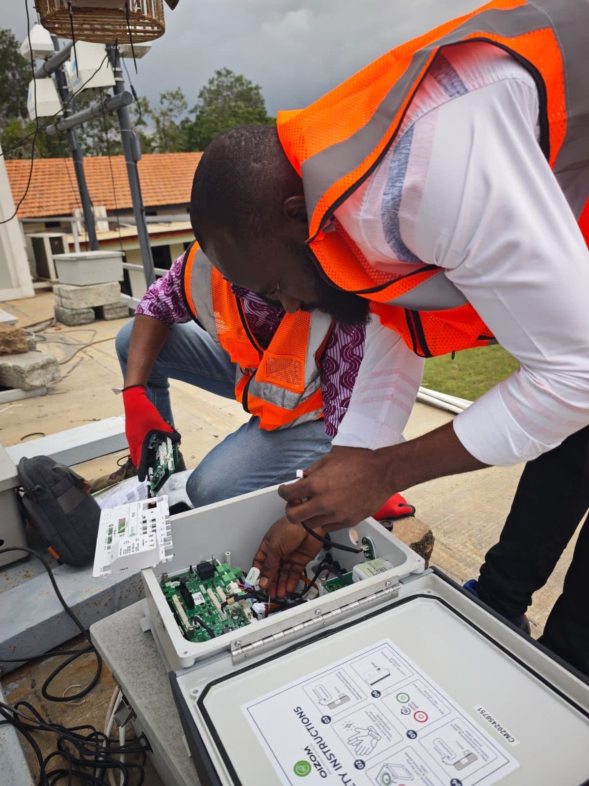 Close-up of an ECHT technician servicing station electronics